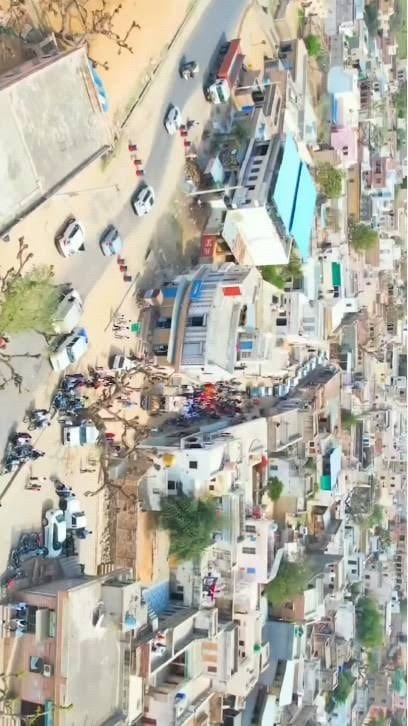 Sherani Abad — aerial view of the village rooftops and main road